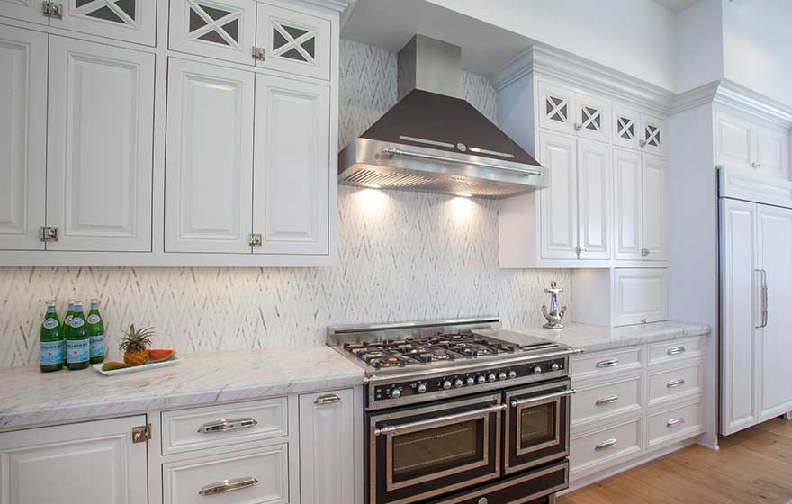 Custom kitchen with white Malibu raised panel mitered cabinet doors