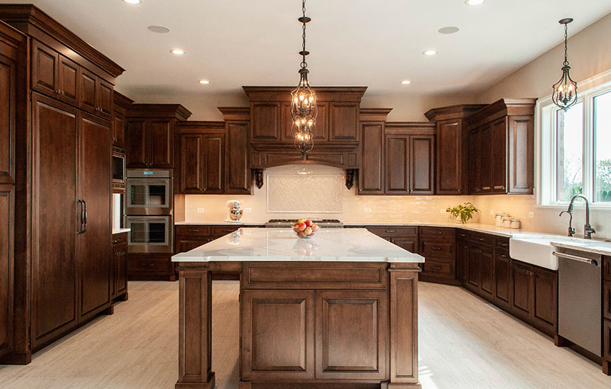 Remodeled kitchen featuring Harmony cabinet doors in dark brown natural wood.