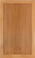 Dixon reeded recessed panel cabinet door shown in Alder Select, with mitered corners and a reeded 2-1/2 inch frame.