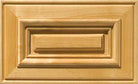 Prudential raised panel drawer front with routed outer edge and applied molding around the center panel