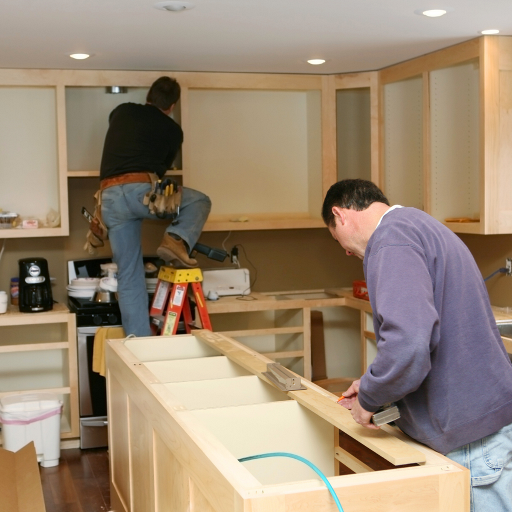 Builders working on cabinets