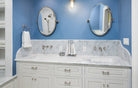 Remodeled bathroom with Century raised panel cabinet doors in white 