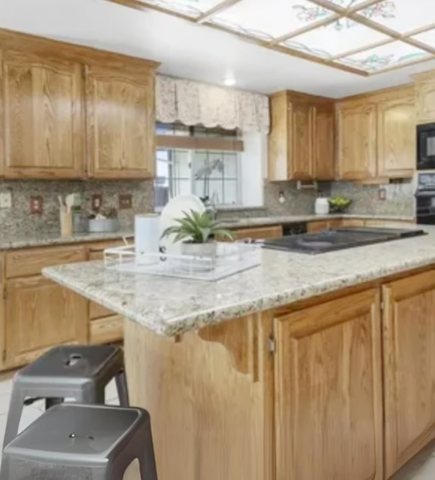 Before image of an old and outdated kitchen