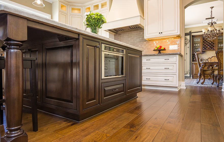 Kitchen island with Heritage cabinet doors in dark natural wood stain