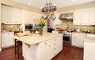 Remodeled kitchen with Heritage raised panel cabinet doors in white